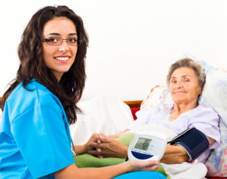 male nurse accompanying elder in walking