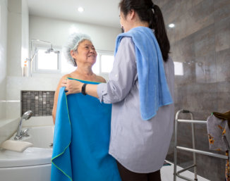 nurse and elder looking each other
