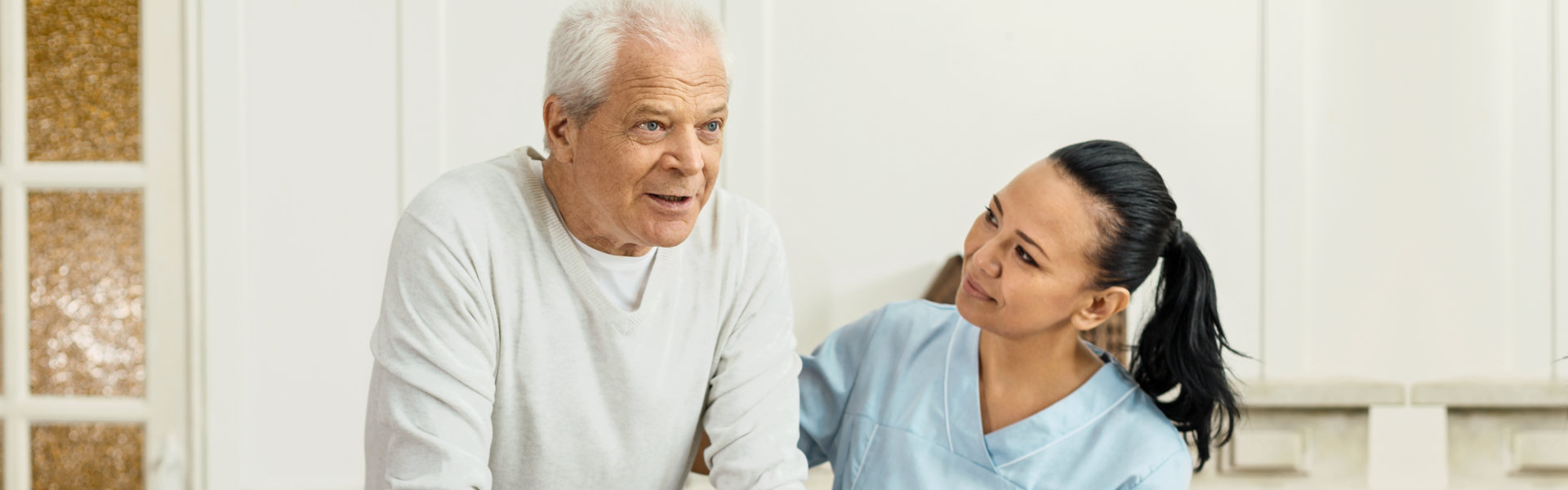 nurse looking at elder
