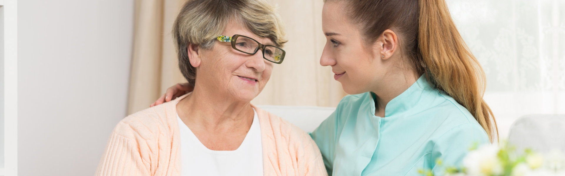 nurse looking at elder
