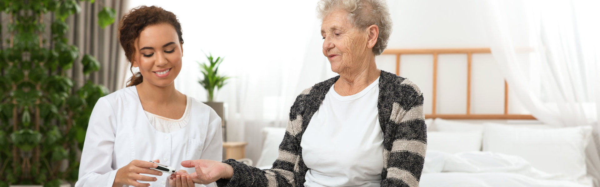 nurse checking on elder's sugar level